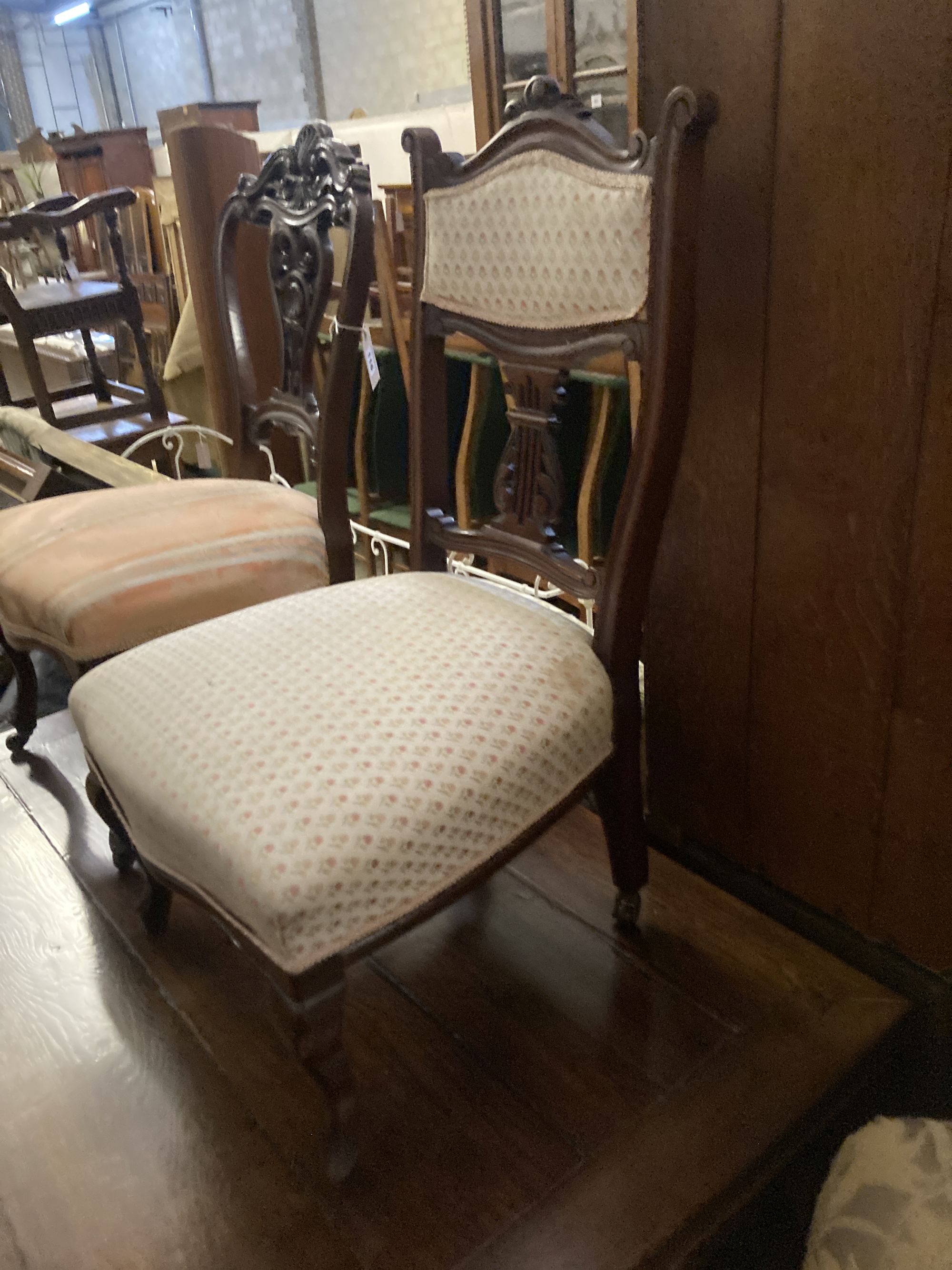 A pair of Victorian walnut dining chairs, on cabriole legs